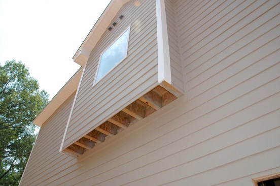 This cantilevered joist system is full of holes that would be troublesome to seal as a callback (see closeup, below).