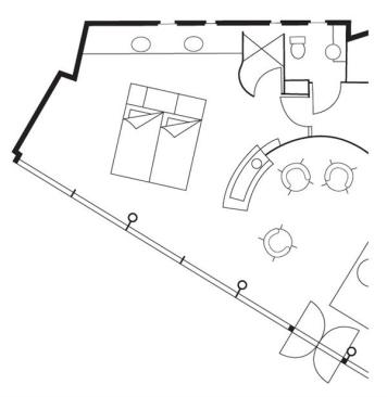The architects enclosed the toilet in a separate room between the master suite and the home's main entry, making it easily accessible to residents and guests