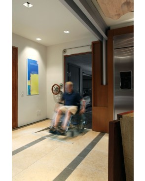 The kitchen also needed to be usable for the clients' son, who uses a wheelchair. He enters the kitchen using a ramp that's manually controlled and simple to operate.