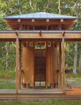 Curved horizontal supports inside the shower are deep enough to hold shampoo, soap, and other necessities.