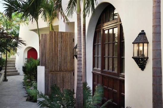 While the oceanfront side of the house is modern, the front reveals its traditional side.