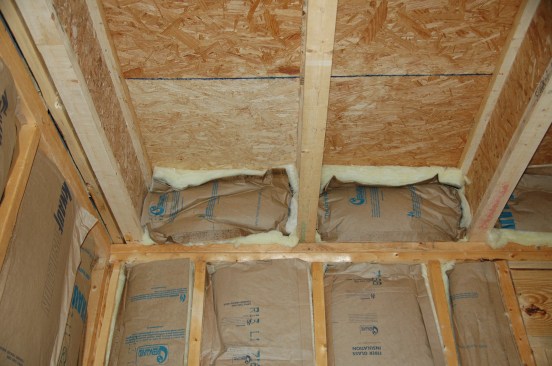 Fiberglass insulation is ineffective at blocking air infiltration at the band joist (or anywhere else).