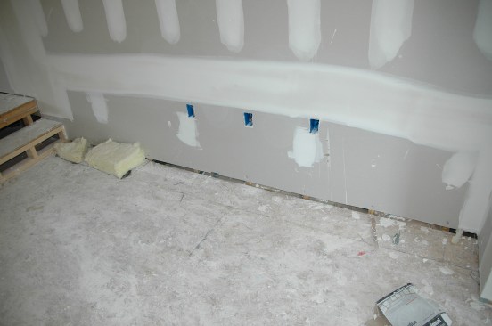 Sole plates at the base of walls are a significant leak point. Even the wall between the garage and the main house should be sealed at this location.