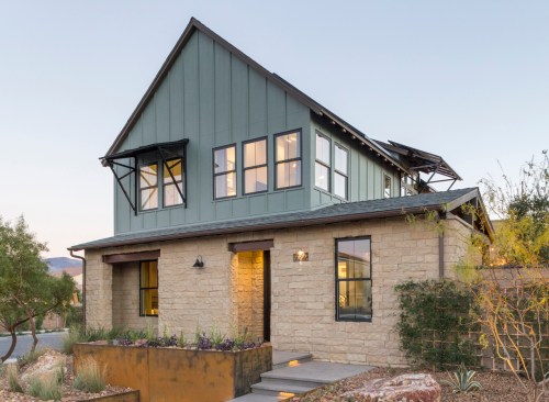 A dark exterior finish on Andersen's 100 Series windows gives a sleek look to the smaller home's exterior.
