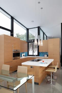 Kitchen and bath cabinetry is faced in continuous-grain Douglas fir.