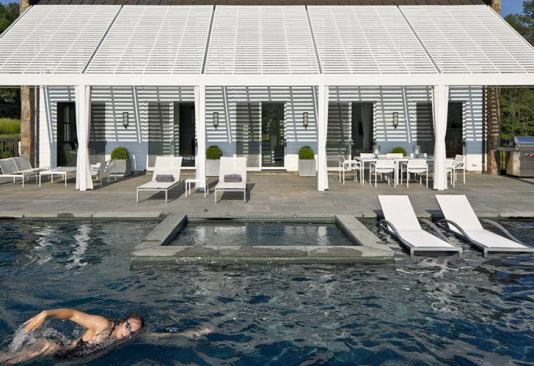 The pool is on the west side of the house, to get the benefit of views and afternoon sun.