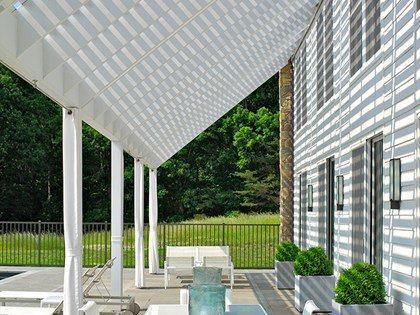 Simple gables, clean lines, and minimalist detailing emphasize the agricultural inspiration for this rural haven.