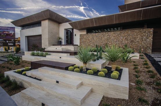 Terraced native landscaping is part of the home's outdoor attraction.