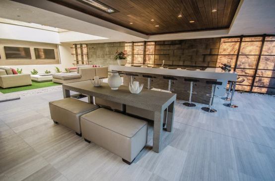 An outdoor kitchen facilitates al fresco dining. 