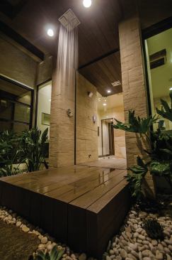 The indoor/outdoor shower is located just off the master bathroom. 