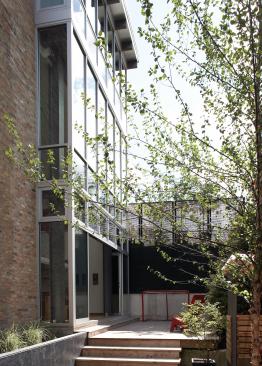 Huge walls of windows bring in light, with outdoor play spaces for both children and grownups. 