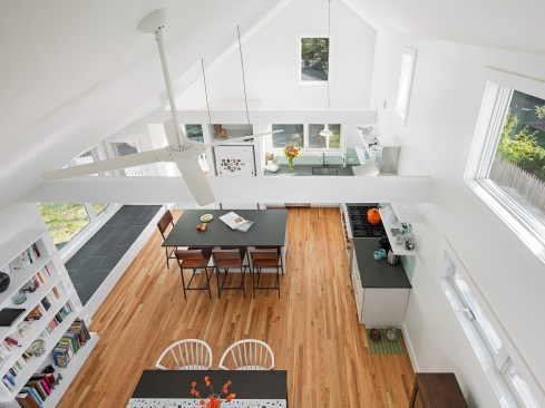 Being able to see the new room from the upstairs of the old house provides an important connection and openness, which expands the still small home visually.