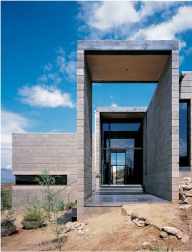 The house steps up the hillside in three terraced levels. Builder Page Repp drilled its foundation directly into the solid rock beneath it.