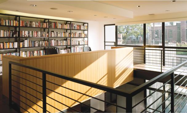 The second-floor office opens onto a small deck with access to the garage-roof terrace. A glassenclosed stair brings light into the core of the building.