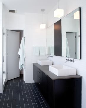 A black-and-white color scheme accentuates the simple rectangular shapes that comprise this master bath.