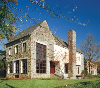 Traditional materials and forms help this contemporary home fit into its neighborhood. 