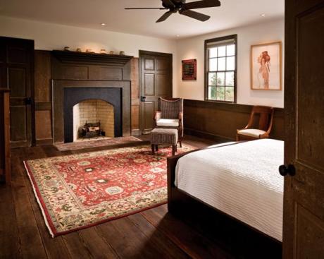 Along with several fireplaces (like this one in the master bedroom), newly added spray-foam insulation helps keep the homes interior temperatures constant.