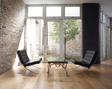 Out of the cavernous spaces, the designers carved entryways, courtyards, and atriums, which gave the growing boys who lived in this house plenty of room to run wild. 