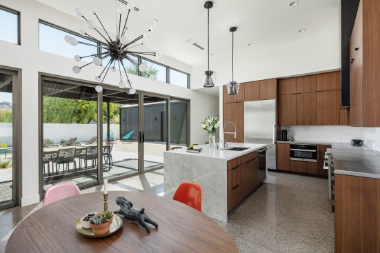 The clients requested details from three interior design styles, including mid-century modern, industrial, and European.