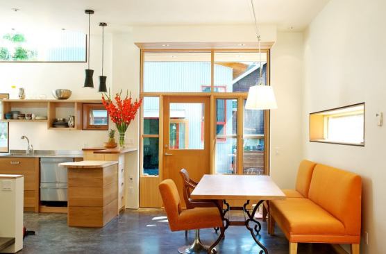House and Laneway House infill project by architect James Tuer. The kitchen and dining room flow together to create an open space in this small home.&nbsp;