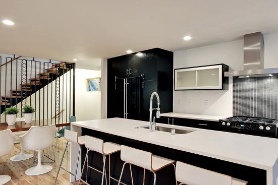 The casework and shelving for the kitchen’s sleek Pacific Crest cabinets are made of agricultural fiber with no added urea formaldehyde. Countertops are nontoxic CaesarStone recycled content surfacing.