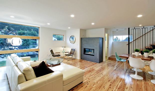 The flooring in the light-filled great room is made of rapidly renewable cypress that was sustainably harvested and finished off-site to protect indoor air quality.