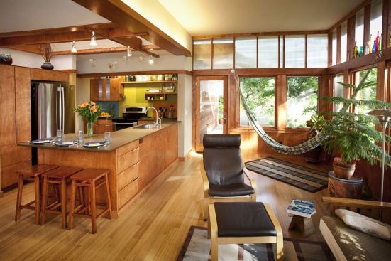 The kitchen is open to the living and dining area to foster interaction with family and guests and to enjoy the expansive view.