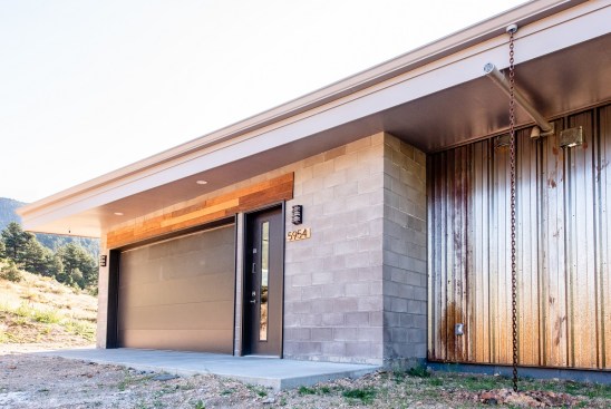 Without a front door, guests are received through the garage, but a traditional entry door was also added to prevent constant garage opening.
