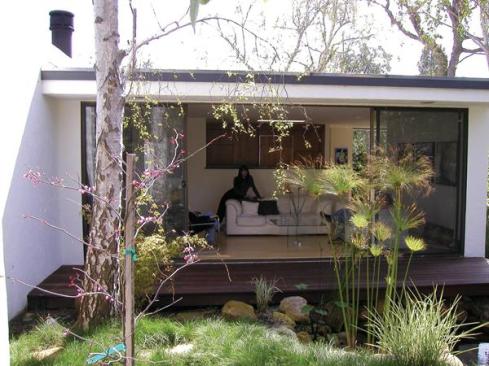 This view of the original patio illustrates the total transformation this home has experienced.