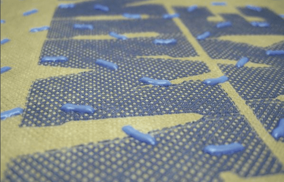 The plastic dots adhered to Benjamin Obdyke's Hydrogap housewrap hold the cladding off the sheathing and provide space for water to drain. This housewrap can be installed in any orientation.