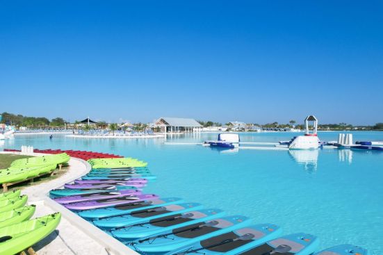 Paddleboards and kayaks line the shore of Mirada Lagoon.
