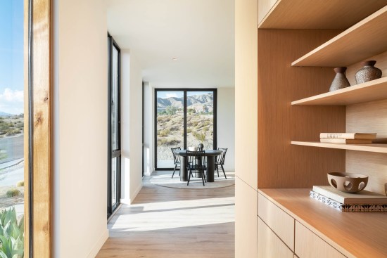 The utility core is clad in white oak and includes built-in cabinets and display shelving.