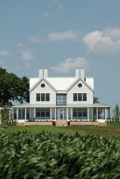 White lap siding and gable ends roughly 18 feet wide take cues from turn-of-the-century farmhouses.