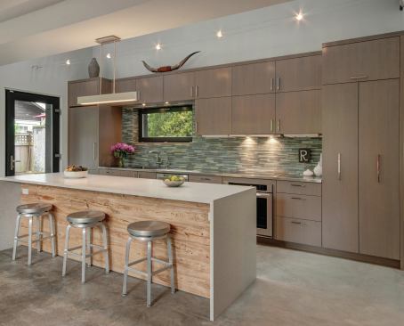Luxurious touches in the kitchen include bamboo strand flooring, an induction cooktop, and custom cabinetry.