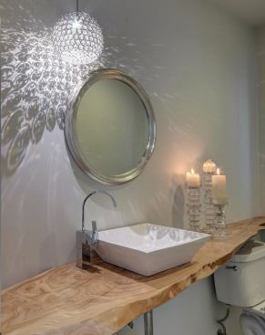 Trees removed from the lot were salvaged for stair treads, wall paneling, and a live-edge bathroom countertop.