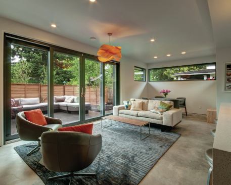 The living room looks out onto the backyard patio.