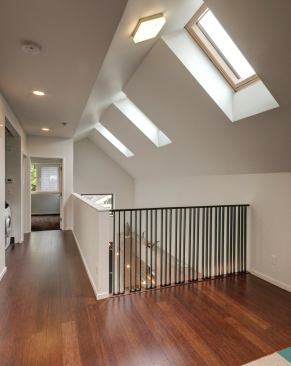 With three interior levels and a roof deck, the 2,710-square-foot house holds four bedrooms and three bathrooms. 