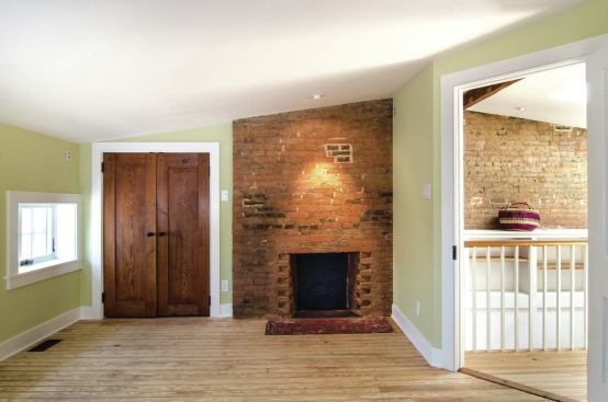 Interiors are completely new, but the design team kept existing elements from the historic building like doors, wood flooring, masonry walls, and ceiling joists. “We tried to show off old pieces and still make a livable space,” explains Swartz.