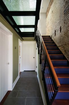 Old wood from the original house was salvaged, cleaned up, and repurposed as stair treads.