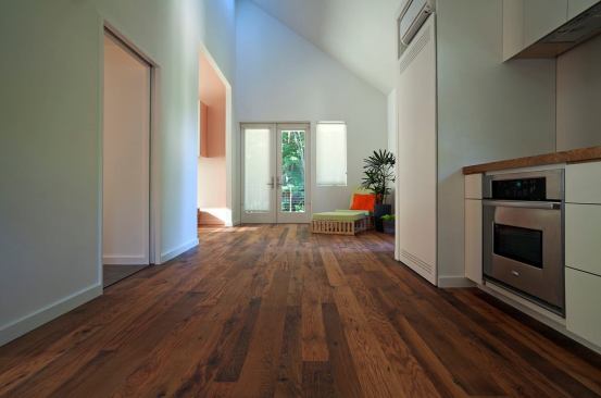 White walls add to a sense of spaciousness to the New Norris House's modest size, while reclaimed oak floors add a warm aesthetic.