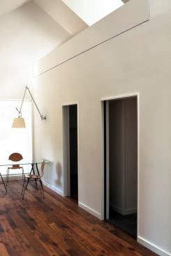 Space-saving pocket doors offer privacy for the bedroom and mudroom off of the main living areas.
