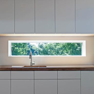 The kitchen includes custom cabinetry tailored to cut down on costs in an effort to keep the home’s price within reach.