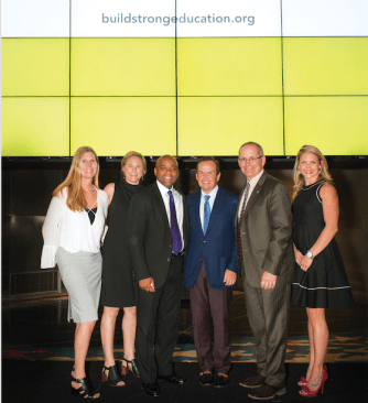 Pat Hamill, Amy Schwartz (second from left), and other team members celebrate the launch of BuildStrong Education.