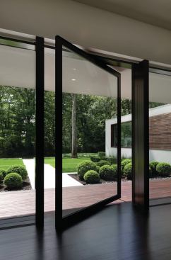 Pivot doors assist in the blending of interior and exterior.