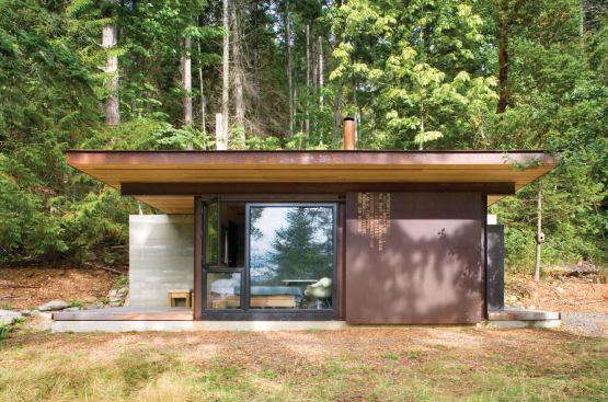 The cabin's exterior skin will be allowed to weather naturally. Its back wall is made of rammed earth.