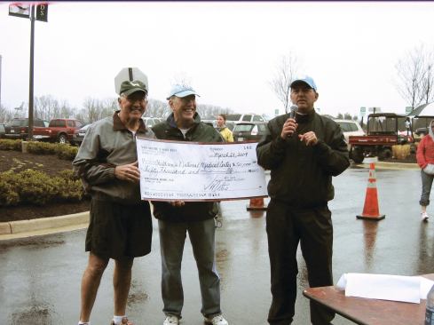 Sunshine on a Cloudy Day: Van Metre Homes’ president Richard Rabil (right), announcing the company’s donation in 2009 of $50,000 to the Children’s National Medical Center. Accepting the donation are, from left, Frank M. Midgley, M.D., the former executive director of the Joseph E. Robert Jr. Center for Surgical Care and division chief of cardiovascular surgery at the Children’s Medical Center, and Kurt Newman, M.D., president and CEO of the Medical Center.