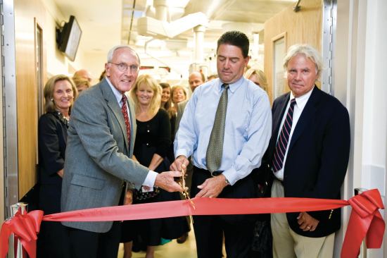 New Wing. Richard Rabil, president of Van Metre Homes (center), cutting the ribbon for the 2010 opening of the Van Metre Cardiovascular Operating Room within the Children’s National Medical Center. With Rabil is the builder's chairman Beau Van Meter (right). Each year, the builder conducts a five-mile race that, so far, has raised nearly $2 million for the Medical Center.