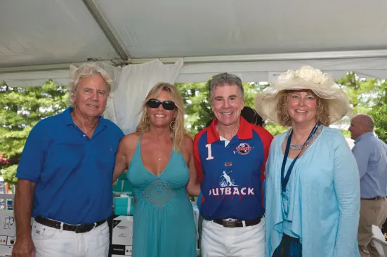 A Break in the Action: Van Metre Homes’ chairman Beau Van Metre and wife Dee (first and second from left) with “America’s Most Wanted” host John Walsh, and Robin Portman, chairman of Capital Caring’s board of directors at the 2011 Van Metre Polo Cup.