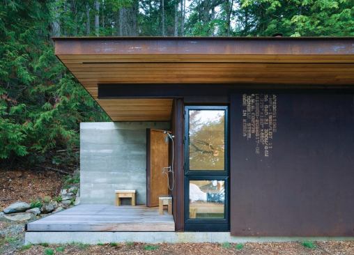 The sliding door also closes partway for privacy. A wood stove provides heat, and a propane tank supplies on-demand hot water.

