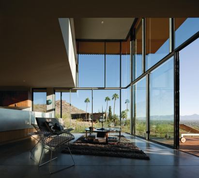The Jarson Residence living area opens to a broad view of desert and sky.